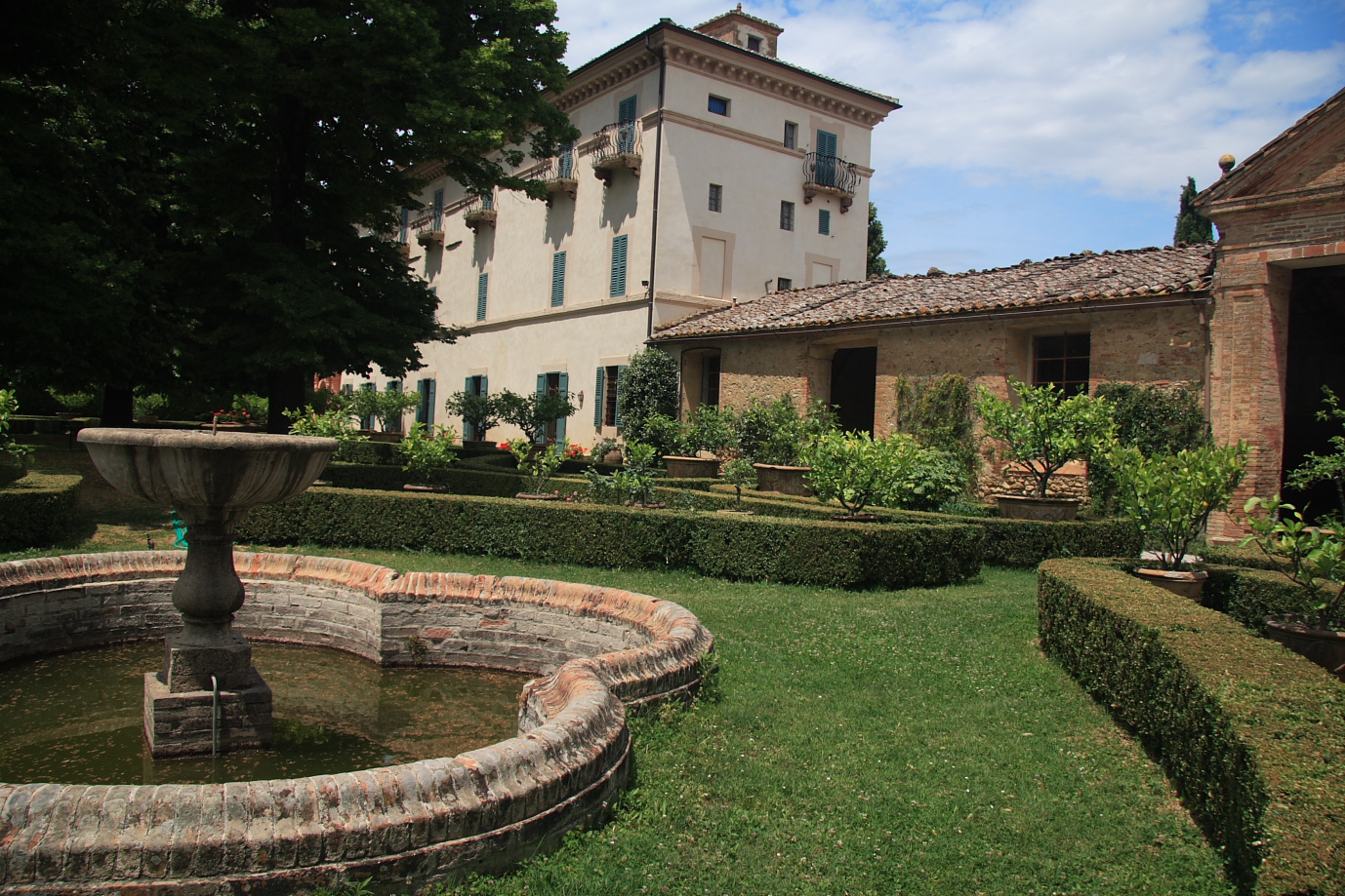 The back view of the gardens around the villa as well as the organerie. 