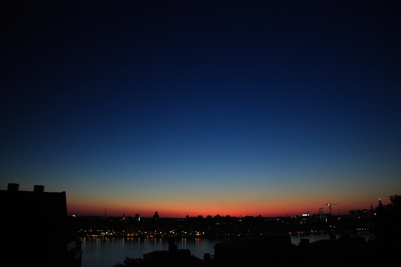 The view from my balcony at 12.30 in the morning. This is about as dark as the sky gets right now.