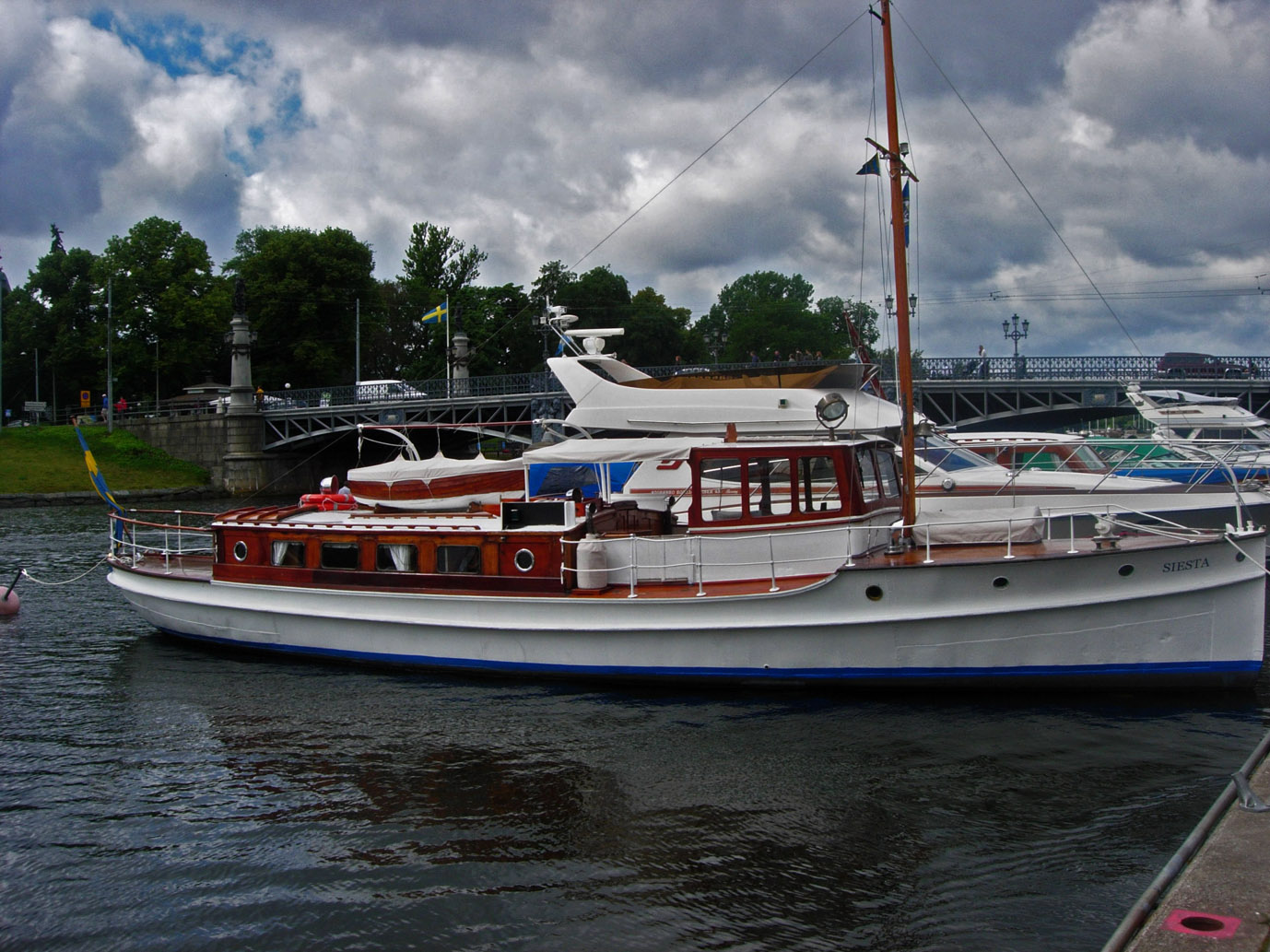 One of the many boats parked along Djugården.