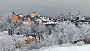 A view looking out over snow-covered rooftops of Södermalm.