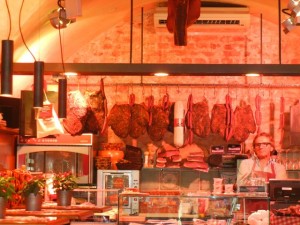 Inside the Tiroler Speckerie was a good-looking selection of meats. innsbruck shopkeeper